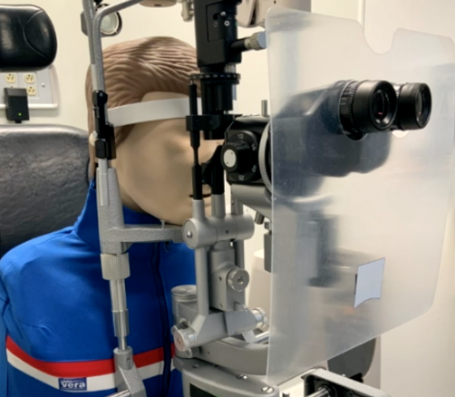 Slit lamp breath shields provide minimal - but not full - protection from respiratory droplets